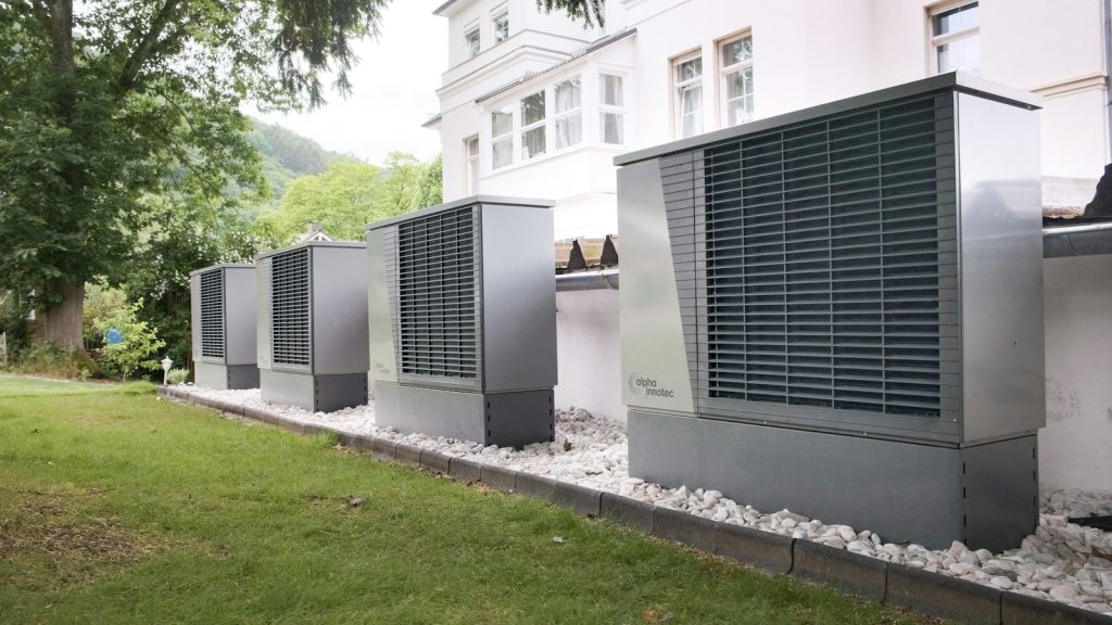 Row of commercial HVAC units outside a building