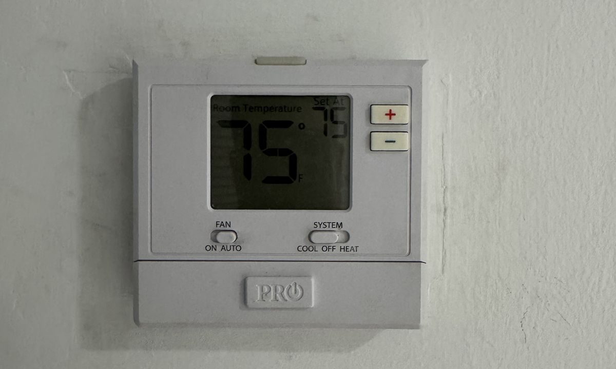 Home thermostat set to 75 degrees