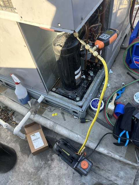 Vacuum pump and micron gauge connected to a rooftop AC unit